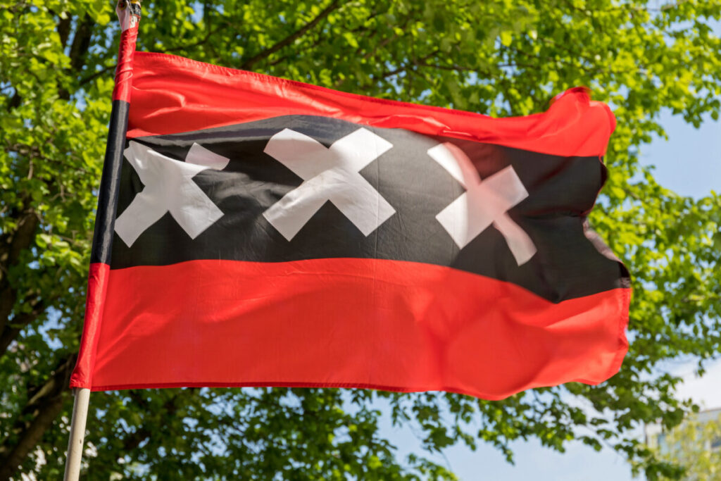 Flag of Amsterdam city design and close-up on a pole