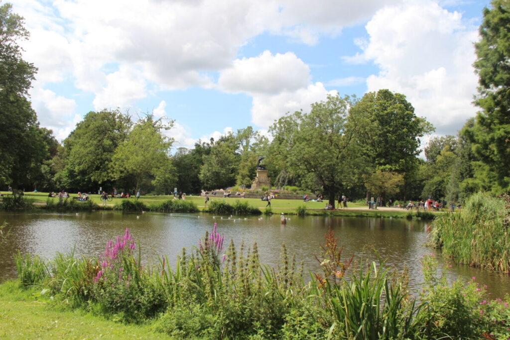 Panoramic view of the Vondelpark green scenery and visitors in Amsterdam, Netherlands