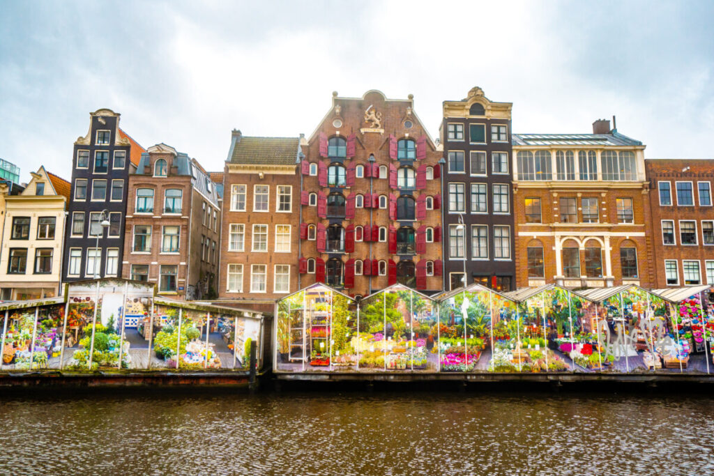 Panoramic view of the Bloemenmarkt by the canals in Amsterdam, Netherlands