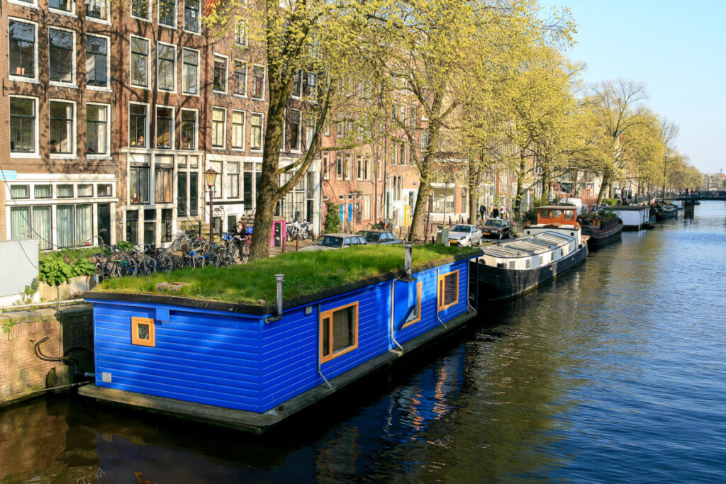 Close-up of a color houseboat in a canal in Amsterdam, Netherlands