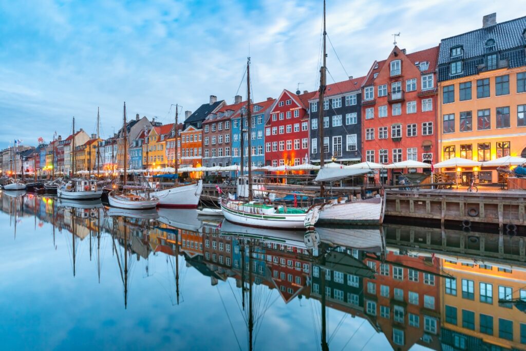 Panoramic view of colorful houses and boats at Nyhavn in Copenhagen, Denmark