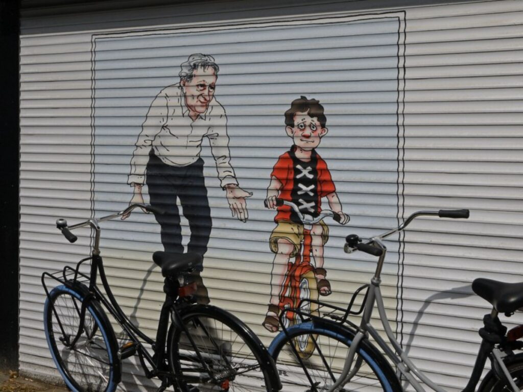 Street Art of a mural on the roller shutter of a shop in De Pijp district, Amsterdam