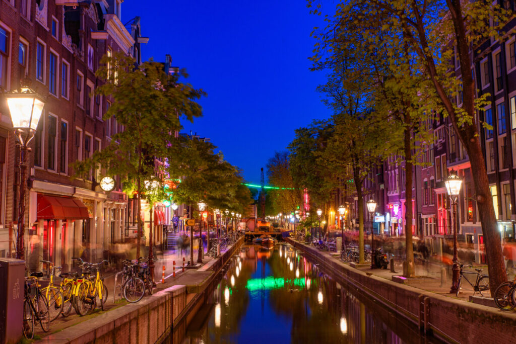 Night view and the establishments of the De Wallen Red Light District in Amsterdam, Netherlands