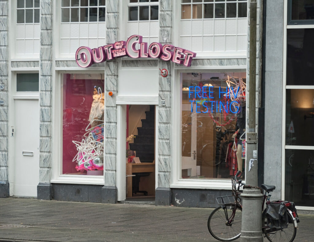 Front and entrance of the Out of the Closet vintage shop at Jodenbreestraat in Amsterdam, Netherlands