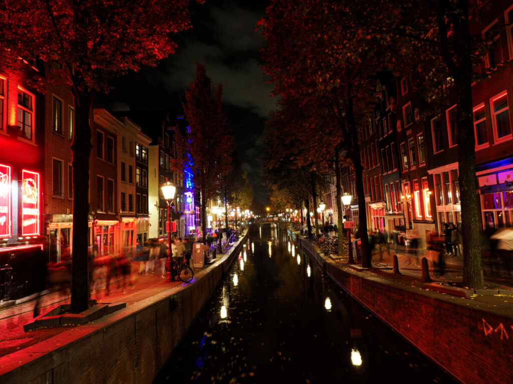 View of the canal and the Red Light District at night in Amsterdam