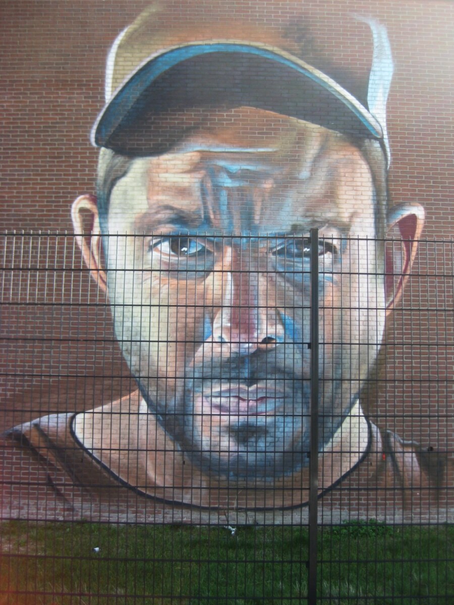 Colorful Telmo Miel mural on IJpromenade in Amsterdam-Noord, showcasing vibrant street art and urban creativity.